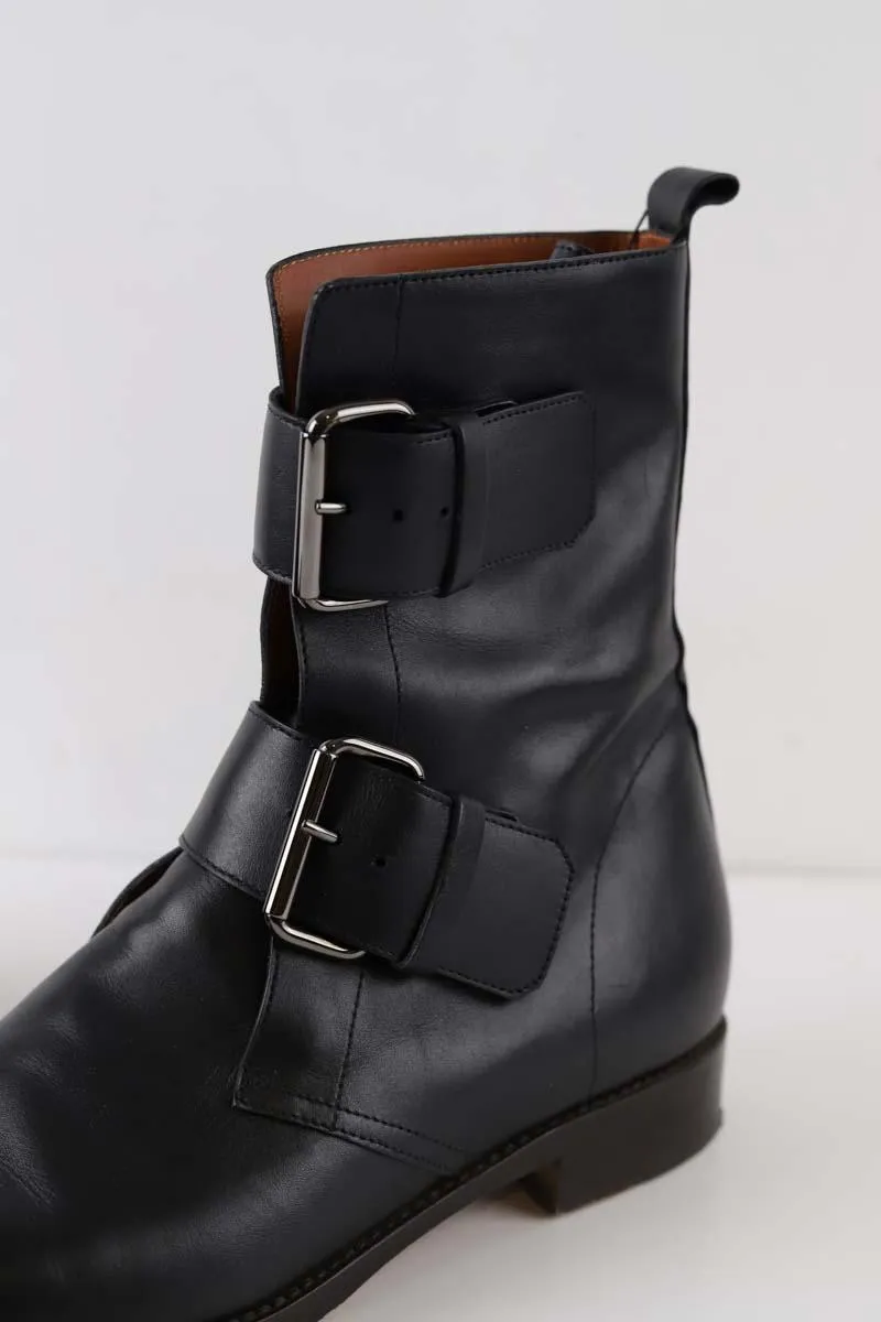 Boots à boucles Michel Vivien noires en cuir, taille 39,5, talons de 2,5cm, tige de 21,5cm, collection femme, en très bon état.