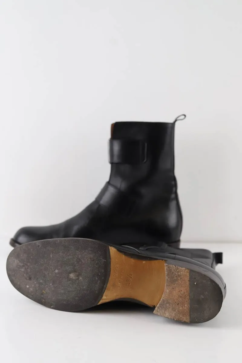 Boots à boucles Michel Vivien noires en cuir, taille 39,5, talons de 2,5cm, tige de 21,5cm, collection femme, en très bon état.